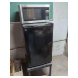 GE Compact Refrigerator and Emerson Microwave Oven on Metal Stand