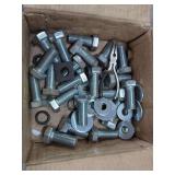 Hex Bolts, Washers, and Pliers in Cardboard Box