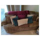 Upholstered Three-Cushion Sofa with Decorative Pillows and Throw