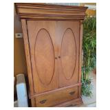 Armoire with Oval Veneer Inlays and Lower Drawer