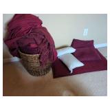 Woven Basket with Assorted Textiles and Pillows
