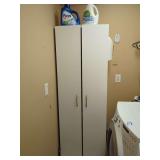 Tall White Storage Cabinet with Assorted Household Contents