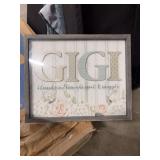 A FRAMED FARMHOUSE STYLE WALL ART WITH THE PHRASE GIGI-