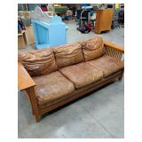 BASSETT LEATHER AND WOOD QUEEN CONVERTIBLE SOFA SLEEPER LETS OUT TO MAKE A QUEEN SIZE BED
