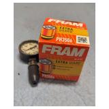 FRAM OIL FILTER AND OLD PRESSURE GAUGE