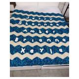 This is a custom handmade chevron zig-zag throw blanket with personalized lettering.