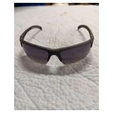 PAIR OF SUNGLASSES WITH READER LENSES BUILT IN