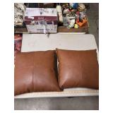 TWO FAUX LEATHER PILLOWS