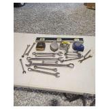 Hand Tools Collection Including Wrenches, Tape Measures, and Level
