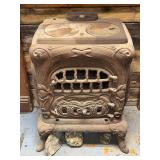 Cast Iron Parlor Stove with Ornate Relief Detailing