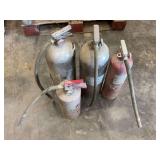 Group of Four Fire Extinguishers