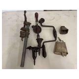 Assorted Metal and Wood Hand Tools Including Hand Drills, Bar Clamp, Brace, and Animal Bells