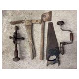 Assorted Hand Tools Including Hand Drills, Hand Saw, Pickaxe, and Hatchet