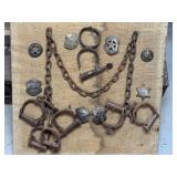 Framed Display of Law Enforcement Badges and Iron Restraints