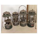 Four Coleman Fuel Lanterns Including Model 220H and Dual Fuel