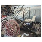 Horse-Drawn Carriage with Tufted Upholstery and Wooden Spoke Wheels