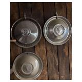 Set of Three Chrome Hubcaps Including Ford Motor Company and Indian Head Motifs