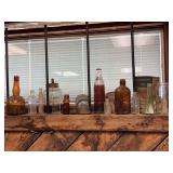 Assorted Glass Bottles and Industrial Insulator Grouping
