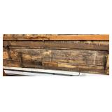 Two Hand Crosscut Saws with Wooden Handles Mounted on Wood Wall