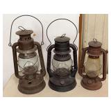 Group of Three Metal Kerosene Lanterns including Embury and Dietz