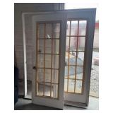 PATIO DOORS AND FRAME. FRAME IS 61 INCHES WIDE X 81 INCHES HIGH.