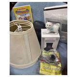 THREE LAMP SHADES, VEGGIETALES DVD, TABLE TOP FOUNTAIN, CERAMIC CAT, MULTIPLE FINGER NAIL CLIPPERS, BICYCLE SEAT, DETROIT TIGERS DECORATION, AND A CLIMBING NET FOR HANGING FLOWERS