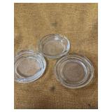 THREE GLASS ASHTRAYS.