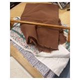 WOODEN TOWEL RACK WITH SMALL BLANKETS AND SOME TIE BACKS