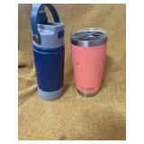 TWO DRINK CONTAINERS. ONE YETI AND A INSULATED CUP WITH STRAW.