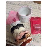 HAIR SCRUNCHIES, HAND SANITIZER, AND A COFFEE CUP