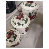 SET OF THREE CANNISTERS. GLASS WITH APPLES DESIGN.