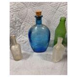 BLUE VINTAGE BOTTLE, TWO SMALL GLASS BOTTLES, AND A VINTAGE MOUNTAIN DEW BOTTLE