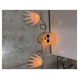 WHITE SKULL WITH HANDS- LIGHTS UP