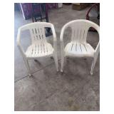 TWO PLASTIC OUTSIDE CHAIRS.