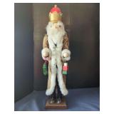 Wooden Nutcracker Figure Wearing Gold and White Regal Attire