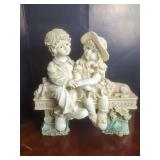 Large Resin Figurine Depicting Children Sitting on Bench with Dog