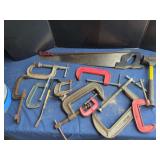 Assorted Hand Tools Including C-Clamps, Hand Saw, and Mallet