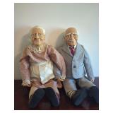 Pair of Elderly Character Dolls with Molded Facial Features and Fabric Attire