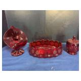 Red Pressed Glass Tableware and Decor Grouping including Trumpet Vase, Oval Coin Bowl, and Covered Candy Dish
