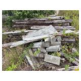 Assorted Wooden Cross Ties And Concrete Blocks