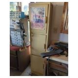 Tall Wooden Cabinet with Tobacco Poster