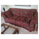 Red Floral Upholstered Sofa with Fringe Accent Pillows