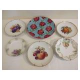 Collection of Decorative Ceramic and Porcelain Plates with Various Floral and Fruit Motifs