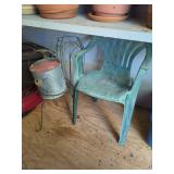 Garden Assortment Including Plant Stands, Watering Can, and Chair