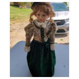 Collectible Porcelain Doll with Green Velvet Dress