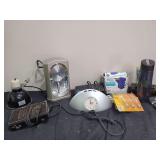 Household Assortment Including Rhythm Clock, Brita Bottle, and Electric Air Pump
