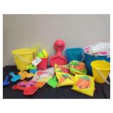 Assorted Plastic Beach Toys Buckets Shovels and Swim Floaties Group