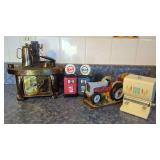 Decorative Kitchen and Collectible Assortment including Stove Music Box, Salt and Pepper Shakers, Tractor Figurine, and Toothpick Dispenser