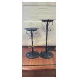 Two matel candle holders  one is 8" tall x 4"wide
