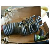 50 ft Recoil hose with nozzle 
Looks preowned